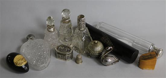 A novelty silver swan pepper, various silver-mounted scent bottles and sundries,